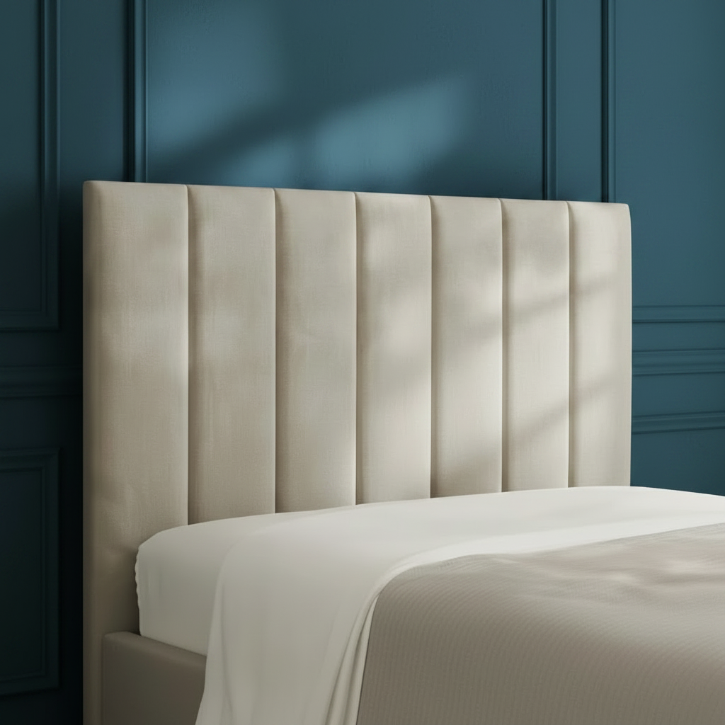 Beige upholstered headboard with a soft texture on a neutral background
