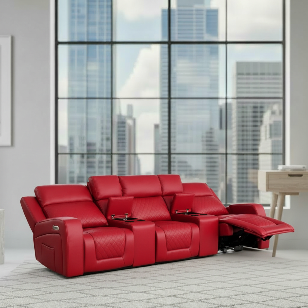 Red leather sofa with reclining seats in a modern room with large windows.