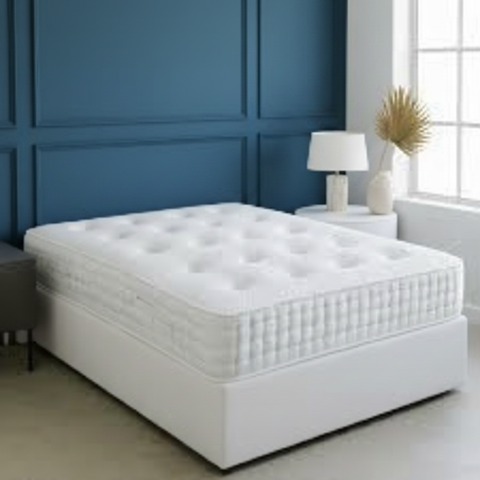 White mattress on a bed in a minimalistic bedroom setting