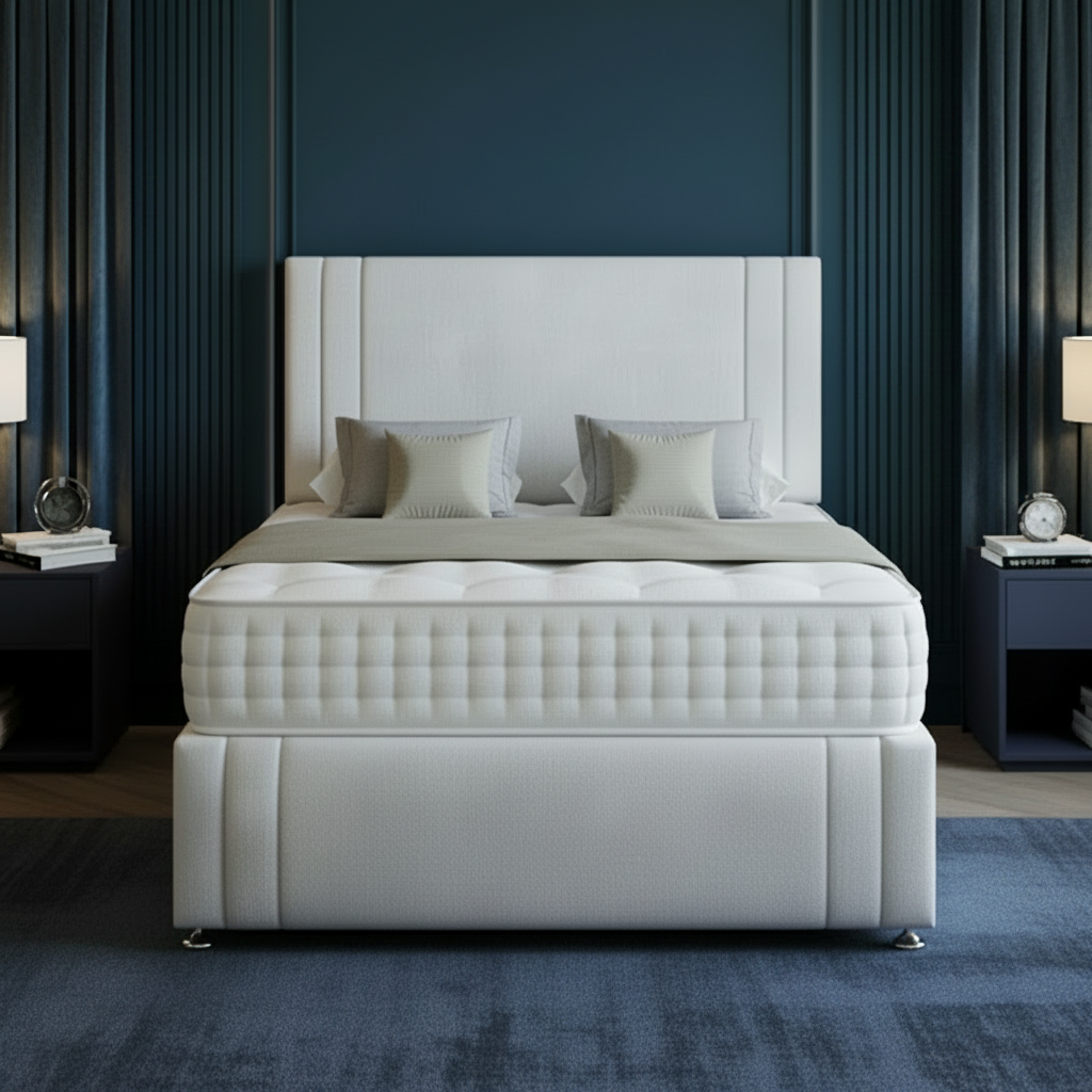 Gray upholstered bed with a white headboard in a bedroom setting.