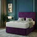 Modern bedroom with a gray bed, nightstands, and decorative elements.