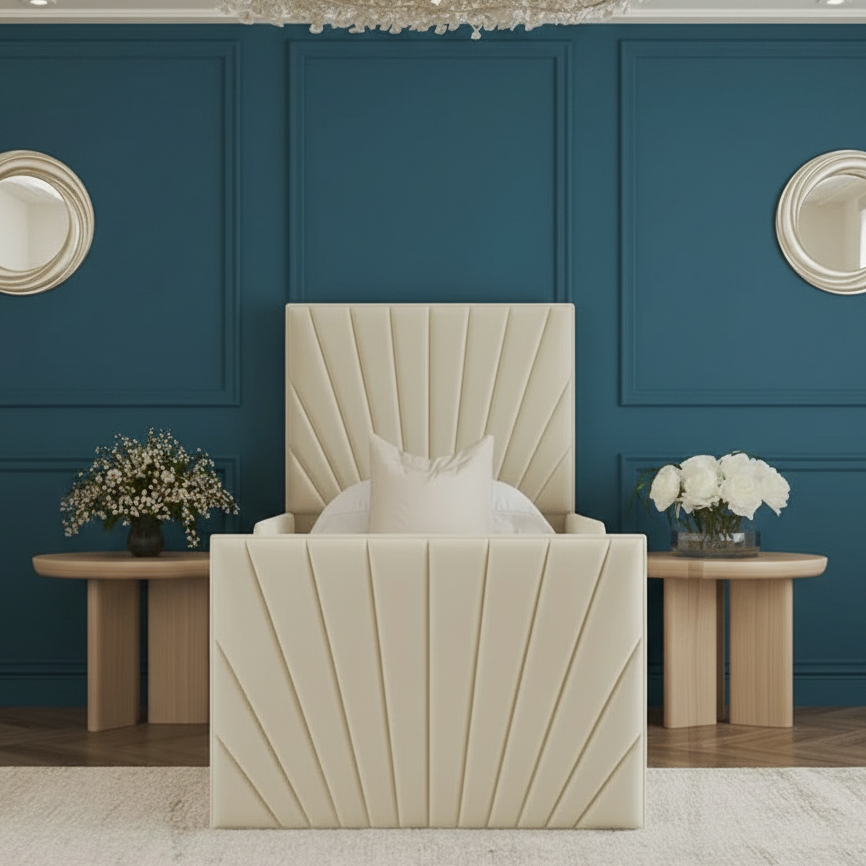 Beige armchair with decorative pillows in a stylish room with mirrors and tables.