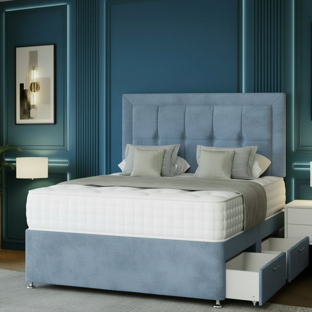 Gray upholstered bed with storage drawers in a bedroom with blue walls.