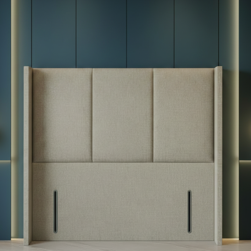 Beige upholstered headboard against a dark blue wall with pendant lights.