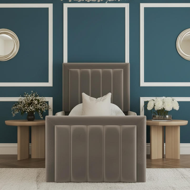 Gray upholstered bed in a stylish bedroom with decorative elements.