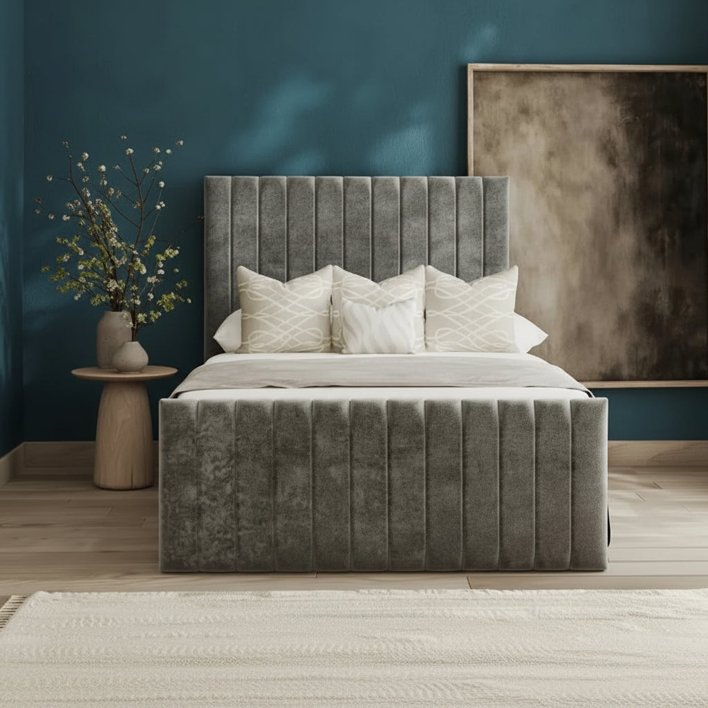 Gray upholstered bed in a bedroom with a side table and abstract painting.