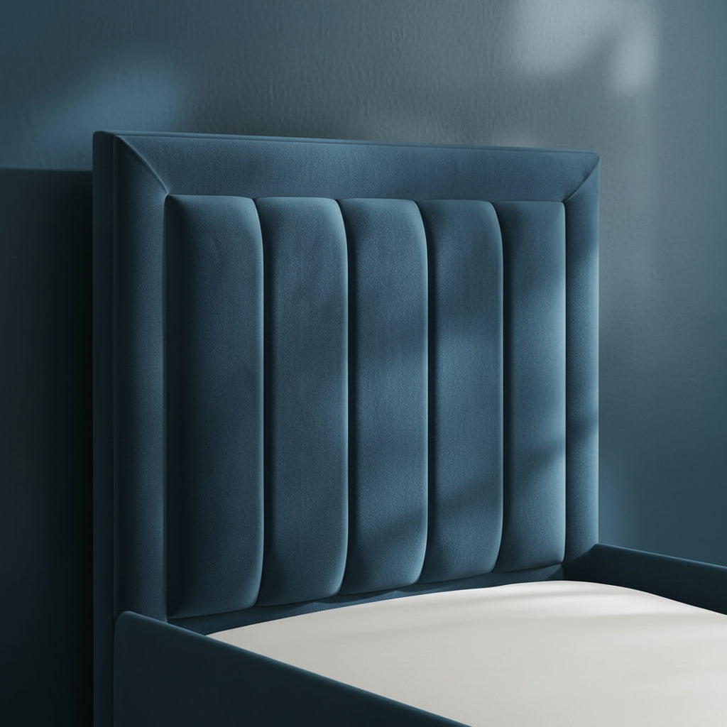 Beige upholstered headboard against a neutral wall
