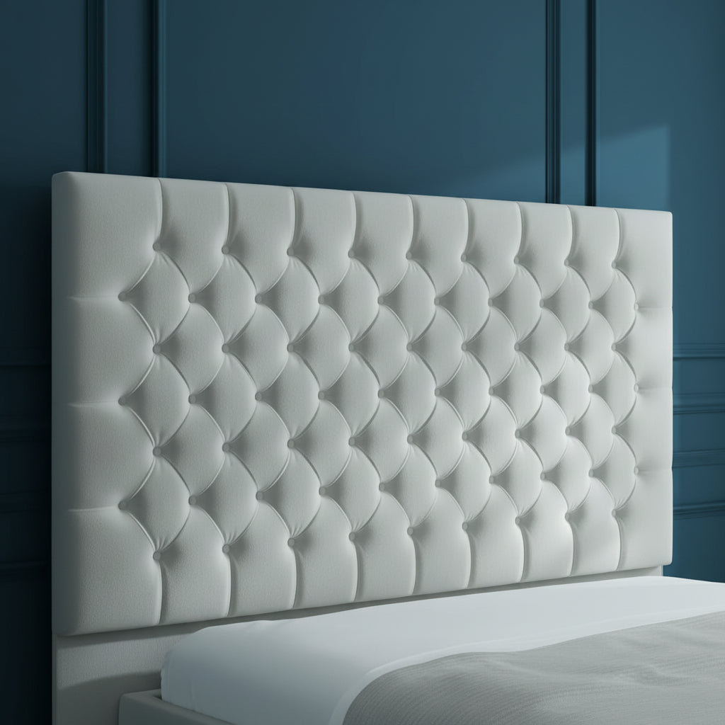 White tufted headboard in a bedroom setting