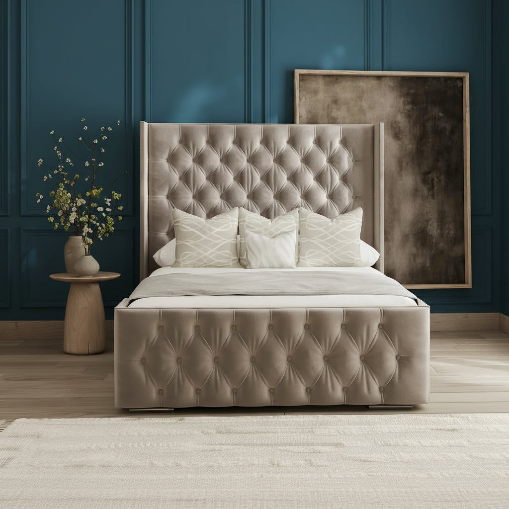 Beige tufted bed with decorative pillows in a room with a textured wall and abstract art.